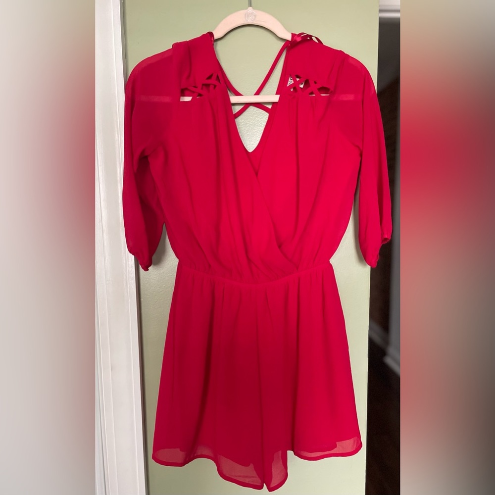 Red Romper with quarter sleeves and elastic waist cinching. Size small.